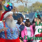 Santa balances a soccer ball at the Kings Lions "Movies with Santa."